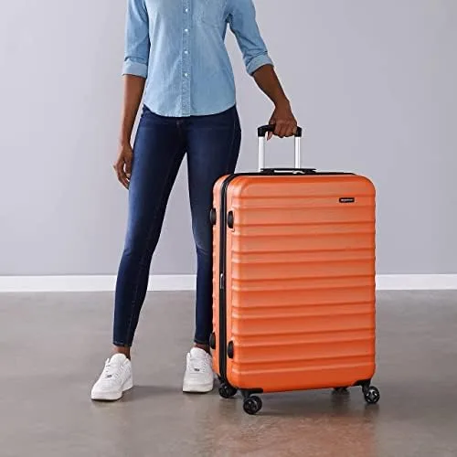 Amazon Basics ▫️ Mala Rígida Grande - Bagagem de Viagem Extensível em ABS com 4 Rodas Duplas Giratórias - Resistente a arranhões e leve - 78 x 52,6 x 32 cm - Laranja Queimado 6