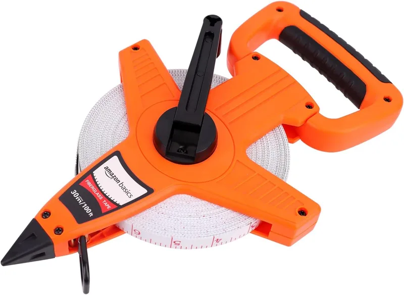 Amazon Basics ▫️ Fita métrica de fibra de vidro com carretel aberto, 30 m, escalas métricas e em polegadas, revestimento resistente a impactos, Laranja