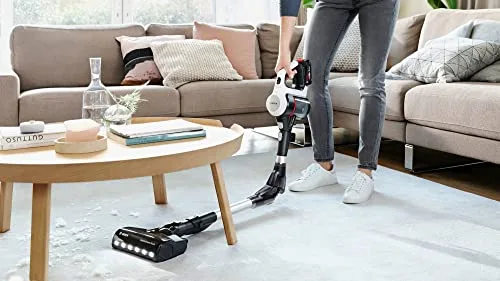 Bosch ▫️ Unlimited 7 BSS711W - Aspirador de mão sem fios e sem saco, bateria de substituição, tubo dobrável, filtro higiénico, 10 anos de garantia do motor, bocal XXL para estofos, iluminação 4