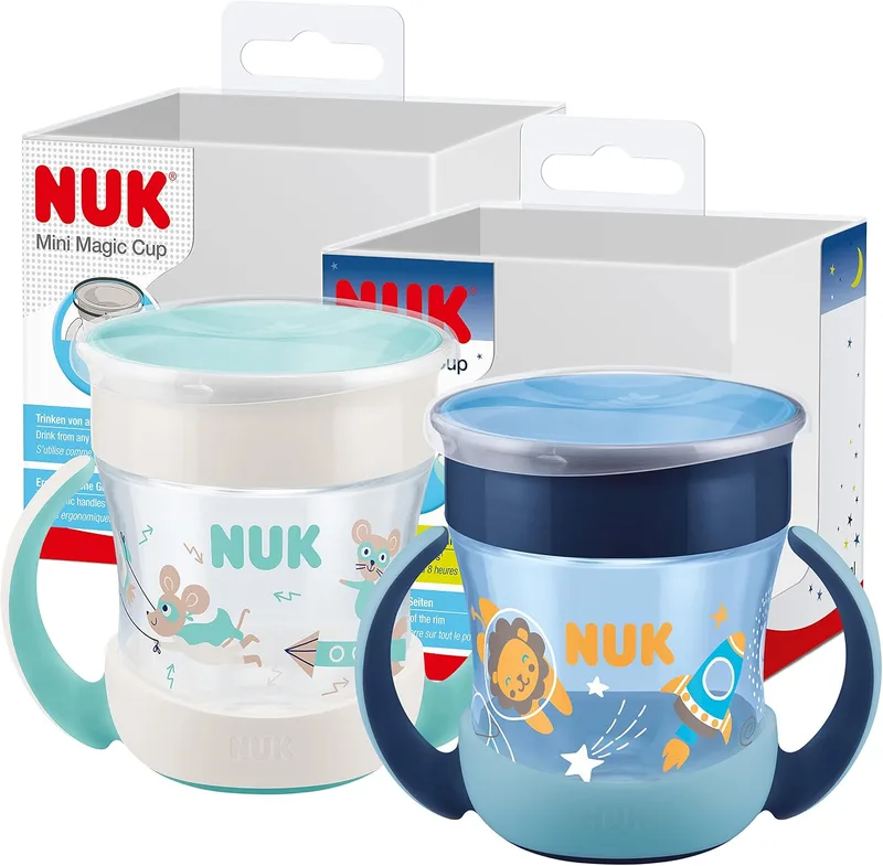 NUK ▫️ Mini Magic Cup Night – copo com bico para beber | +6 meses | 160 ml | Borda à prova de derrames de 360° para beber de qualquer lado | Brilha no escuro | Sem BPA | Leão (azul) | 2 unidades.