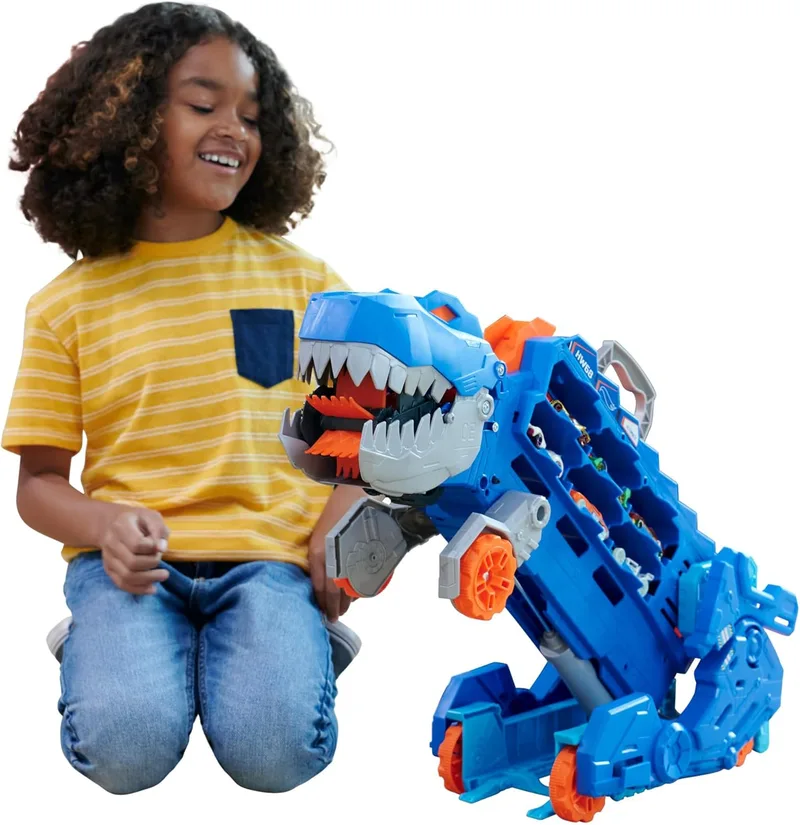 Hot Wheels ▫️ City «Let's Race - Vamos à corrida!» Netflix - Camião T-Rex definitivo, dinossauro, transporte e pista para carros de brincar, inclui 2 veículos, a partir dos 4 anos (Mattel HNG50)
