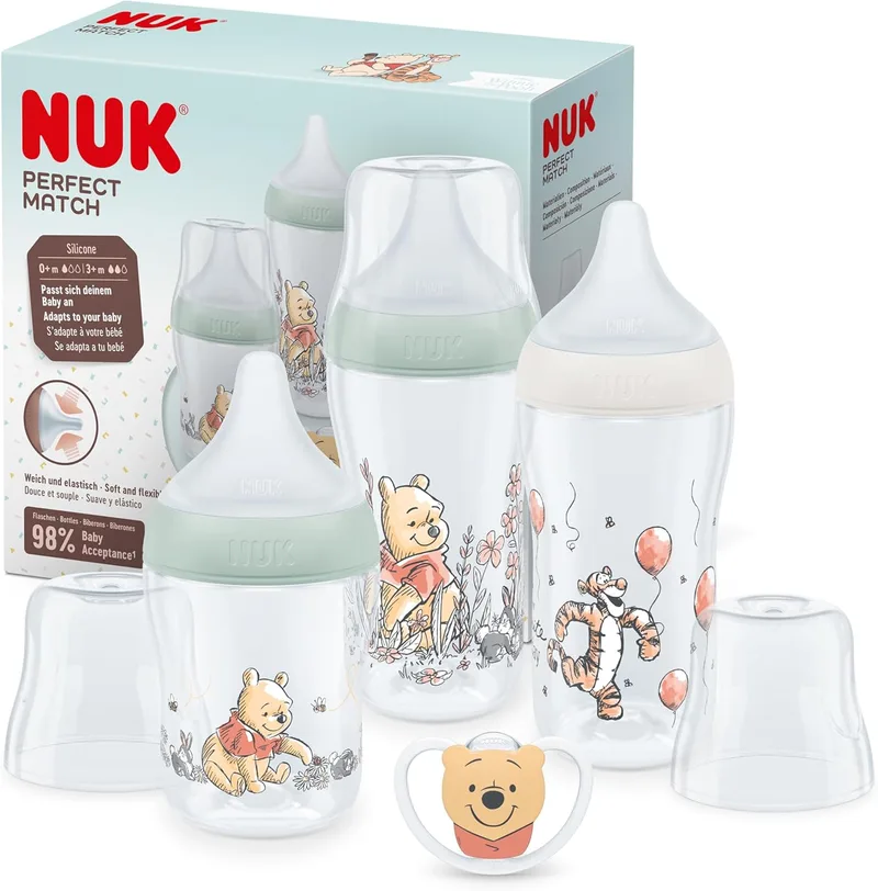 NUK ▫️ Conjunto de biberões Perfect Match : +0-6 meses : Adapta-se ao bebé como um peito : 3 biberões anti-cólicas e chupeta Espaço : Disney Winnie the Pooh : 4 peças.