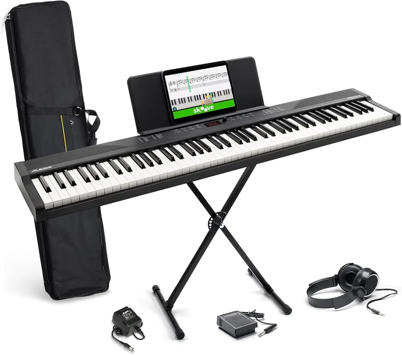Alesis ▫️ Teclado de piano com 88 teclas e 480 sons, altifalantes, MIDI USB, estojo, suporte, auscultadores, pedal e lições de piano incluídas